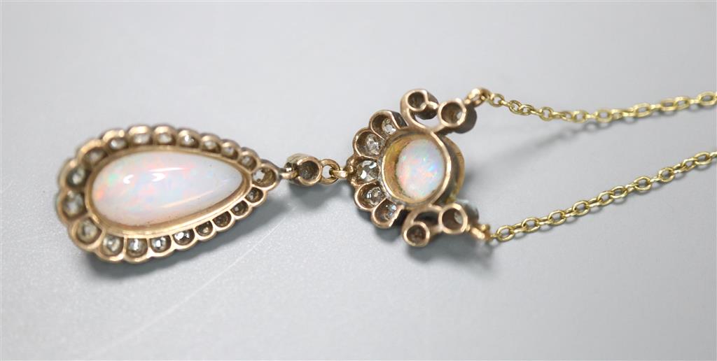 An Edwardian yellow and white metal, two stone white opal and diamond cluster set drop pendant necklace,